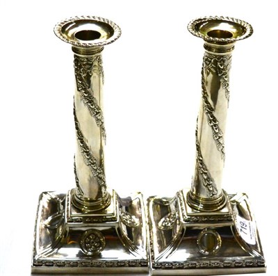 Lot 719 - A pair of Victorian silver candlesticks, London 1887