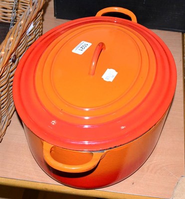 Lot 1021 - Large Le Creuset orange enamel cast-iron oval casserole with cover