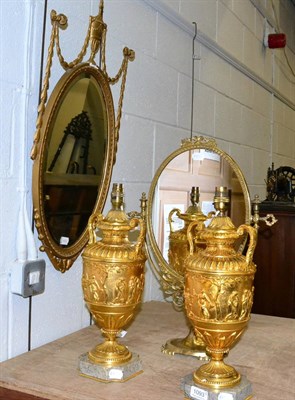 Lot 1093 - A pair of reproduction gilt metal urn form table lamps together with a gilt composition mirror...