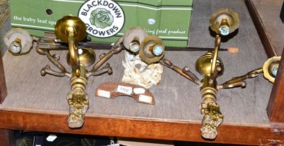 Lot 1102 - A pair of Victorian brass three branch wall lights, a Victorian ";Iris"; cast iron door stop...