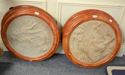 Lot 1137 - A set of four large plaster roundels modelled with classical figures