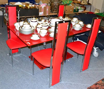 Lot 1138 - A red glass table and four chairs