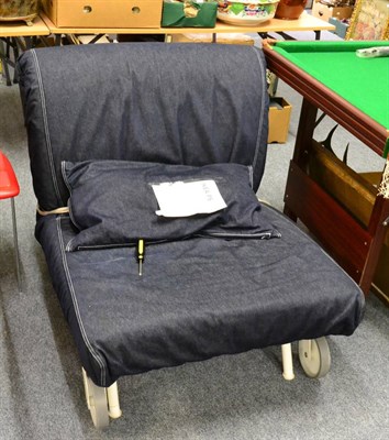 Lot 1139 - An Ikea PS Lovas chair bed in navy denim with mattress and cushion