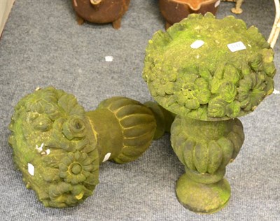 Lot 1147 - A pair of carved stone flower urns