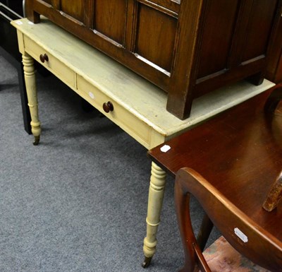 Lot 1162 - A painted pine farmhouse side table fitted with two drawers