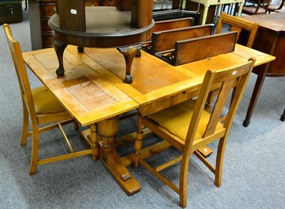 Lot 1166 - An oak table and four matching chairs