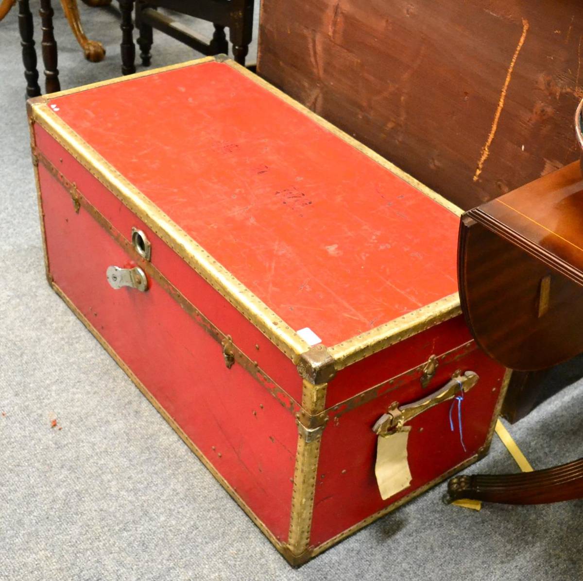 Lot 1173 - A vintage red trunk