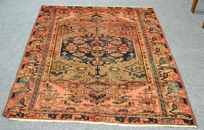 Lot 1180 - A Hamadan rug, Iranian Kurdistan, the field with a stepped medallion, 207 by 121cm, together with a