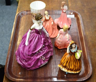 Lot 1186 - Four Coalport figures, a Royal Doulton figure, a Shelly Royal Commemorative beaker and an oak cased