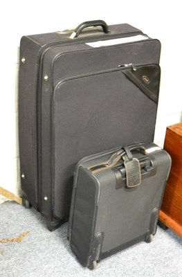 Lot 1215 - A Longchamp carry-on case and a large Samsonite roller suitcase