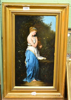 Lot 1269 - Continental School (19th/20th century) Standing classical maiden holding an urn, signed, oil on...