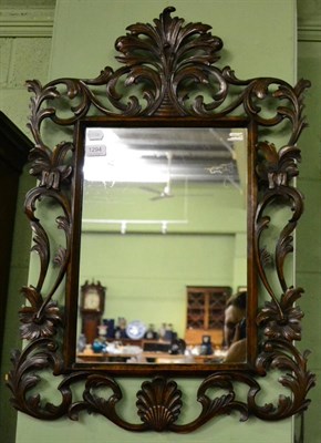 Lot 1294 - A Spanish carved wood baroque mirror