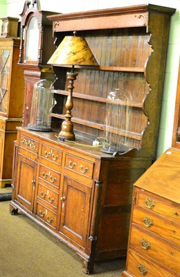 Lot 1301 - An 18th century oak dresser and rack