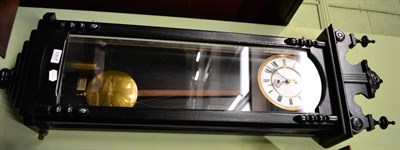 Lot 1317 - A Vienna type wall timepiece in ebonised case, single weight driven movement