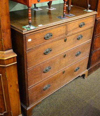 Lot 1321 - An oak four height chest of drawers