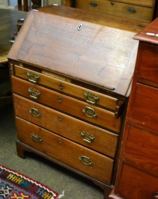 Lot 1332 - A George III mahogany bureau