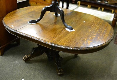 Lot 1354 - Carved oak pedestal table with leaf