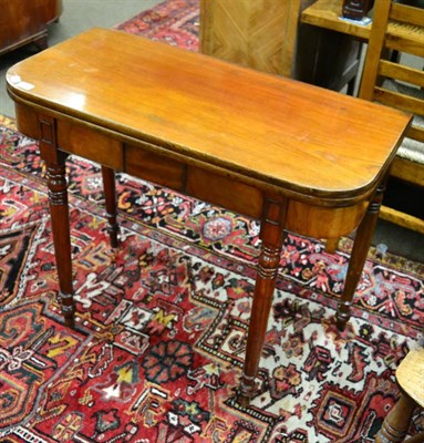 Lot 1357 - A 19th century mahogany fold over table