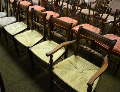 Lot 1370 - A set of four oak framed country chairs with rope work seats