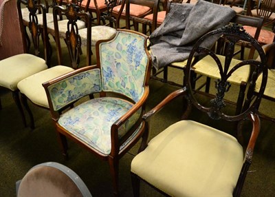 Lot 1373 - A late Victorian satinwood framed open tub chair, a carved mahogany open armchair and a pair of...