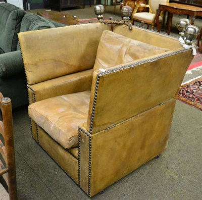 Lot 1378 - A studded leather Parker Knoll armchair with drop arms