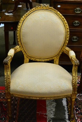 Lot 1381 - A pair of Louis XVI style gilt fauteuils