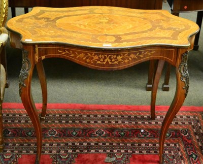 Lot 1382 - A French shaped oval marquetry table in Louis XV style, with drawer, circa 1900