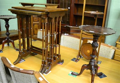 Lot 1409 - A nest of three mahogany tables, a rectangular table from a nest, a George V inlaid folding...