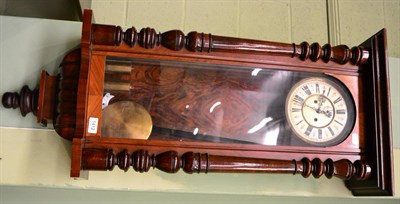 Lot 1412 - A walnut veneered Vienna type striking wall clock, with double weight driven movement, together...