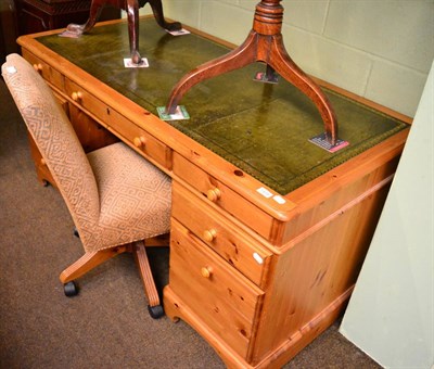 Lot 1414 - A leather inset pine pedestal desk and upholstered office chair