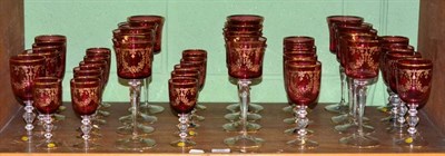 Lot 109 - A suite of thirty six cranberry 'Bohemia Glass' glasses