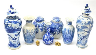 Lot 133 - A group of Oriental items including, a pair of blue and white covered vases, a pair of blue and...