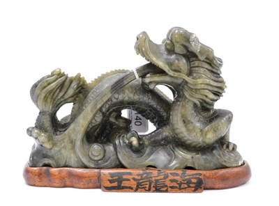 Lot 140 - A Chinese soapstone figure of a dragon, on stand