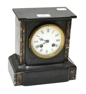 Lot 142 - A black slate striking mantel clock