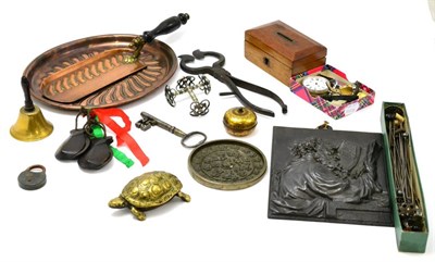 Lot 147 - Tray of assorted collectable items including a small brass bell, various hat pins, copper crumb...