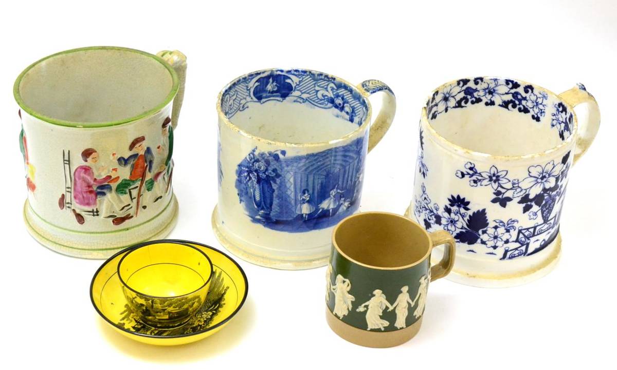 Lot 164 - A collection of four Staffordshire mugs and an 18th century yellow glazed tea bowl and saucer...