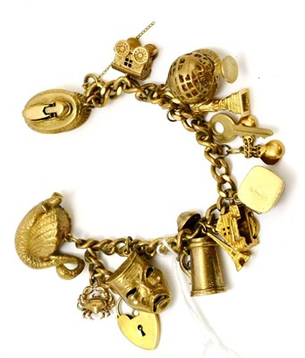 Lot 194 - A 9ct gold charm bracelet, 82.7g