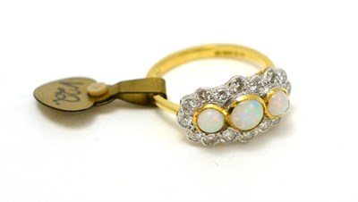 Lot 198 - An 18ct gold opal and diamond triple cluster ring