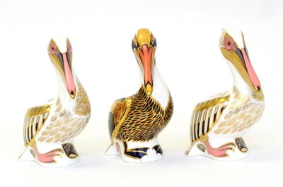 Lot 218 - Three Royal Crown Derby Paperweights including: Brown Pelican (silver stopper) and two White...