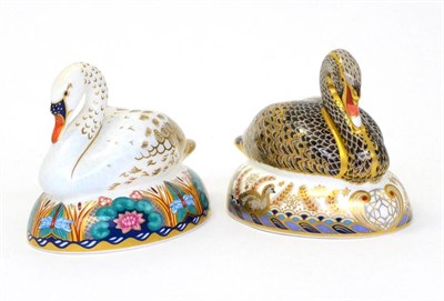 Lot 222 - Two Royal Crown Derby paperweights including: Black Swan (gold stopper) and White Swan (silver...