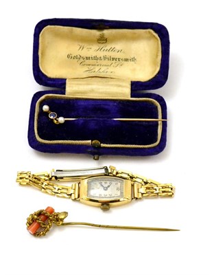 Lot 273 - A watch and two stick pins, one stick pin contained in a purple box