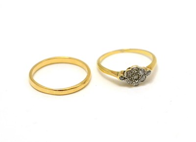 Lot 294 - An early 20th century diamond cluster ring and a band ring (2)