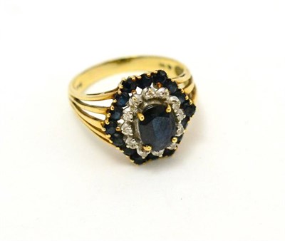 Lot 299 - A sapphire and diamond hexagonal cluster ring, stamped '14K'