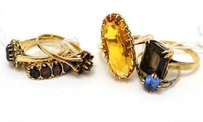 Lot 303 - Three garnet dress rings and three others (6)