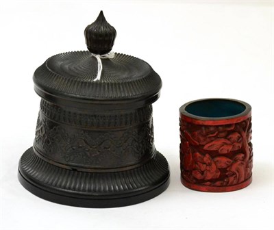 Lot 311 - A turned snuff box and a Chinese cinnabar lacquer brush pot