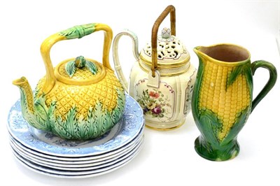 Lot 334 - An unusual teapot with reticulated lid, majolica and blue and white plates, pottery sweet corn...