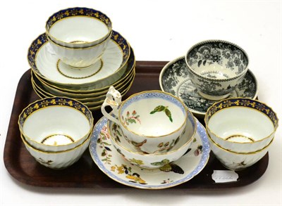 Lot 344 - Six blue and gilt tea bowls and saucers and a black printed tea bowl and saucer