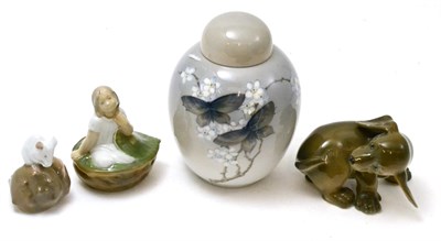 Lot 360 - A Royal Copenhagen puppy, a ginger jar and cover and a mouse and girl seated on leaf (4)