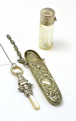 Lot 383 - Nina Ricci wrythen glass scent bottle with later Victorian silver mount, silver child's rattle with