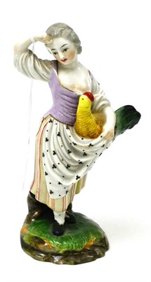 Lot 413 - A German porcelain figure of a lady with a cockerel